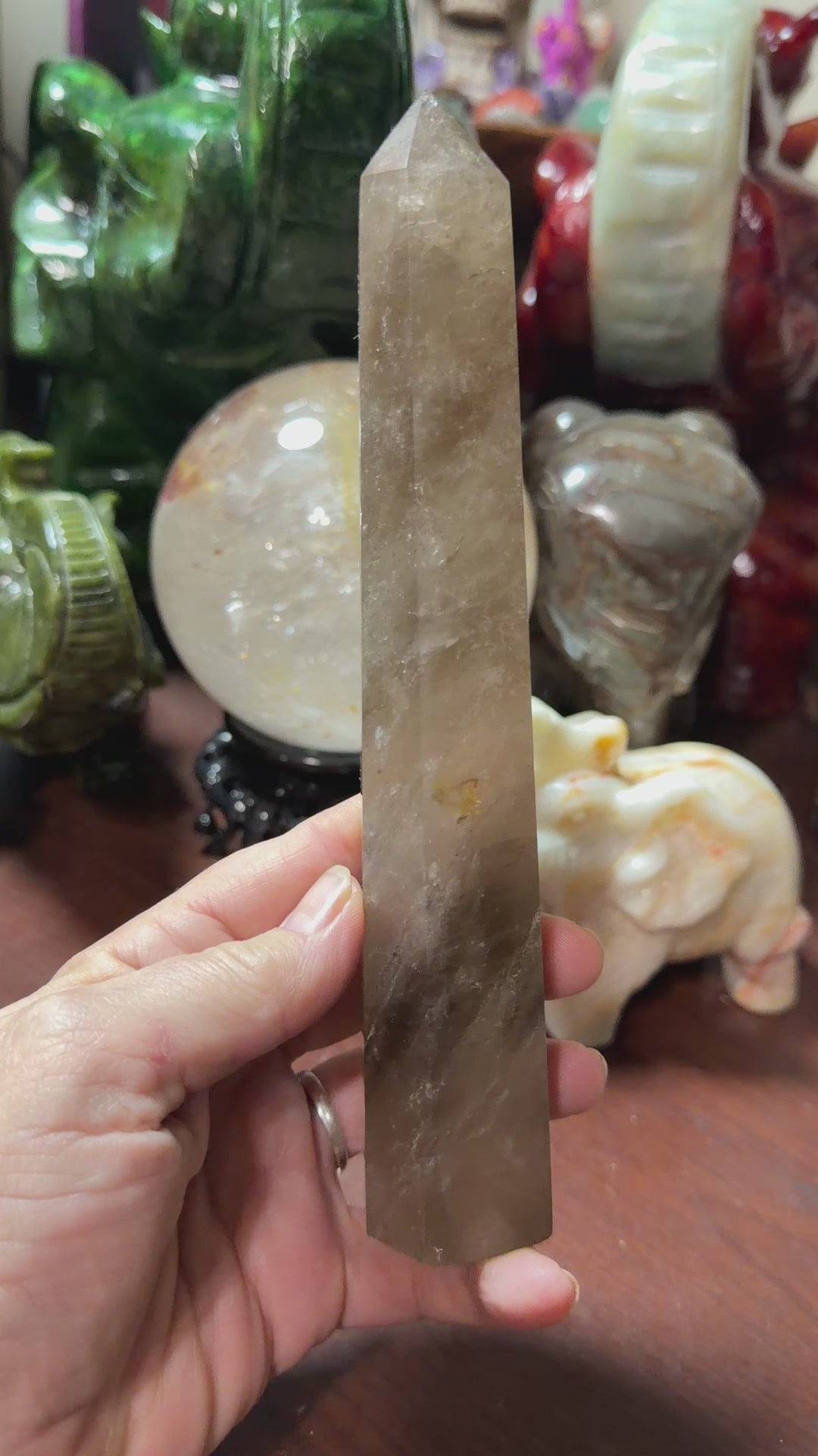Video preview of natural smoky quartz crystal tower with polished point