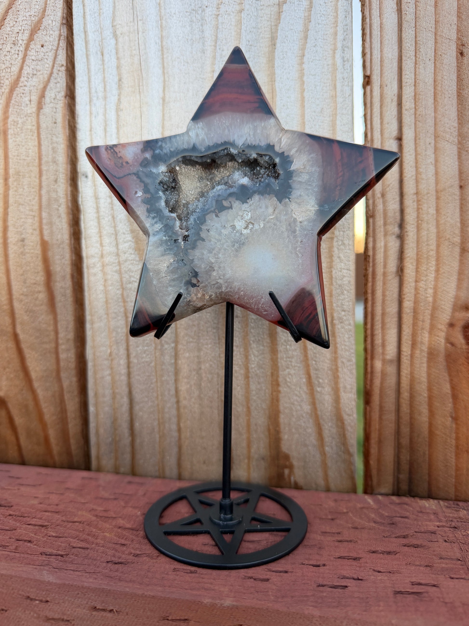 Sardonyx star on display stand