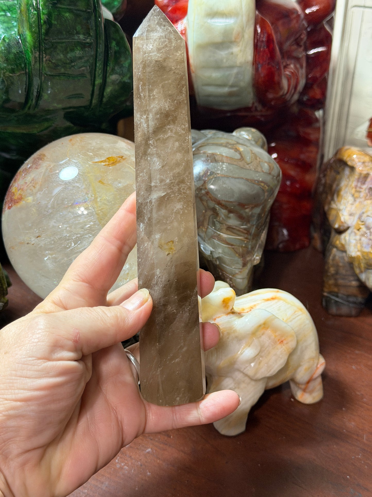 Back view of smoky quartz crystal tower with natural internal inclusions