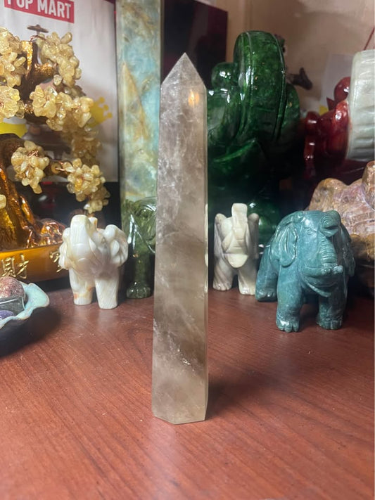 Natural smoky quartz crystal tower with polished point, exact piece shown