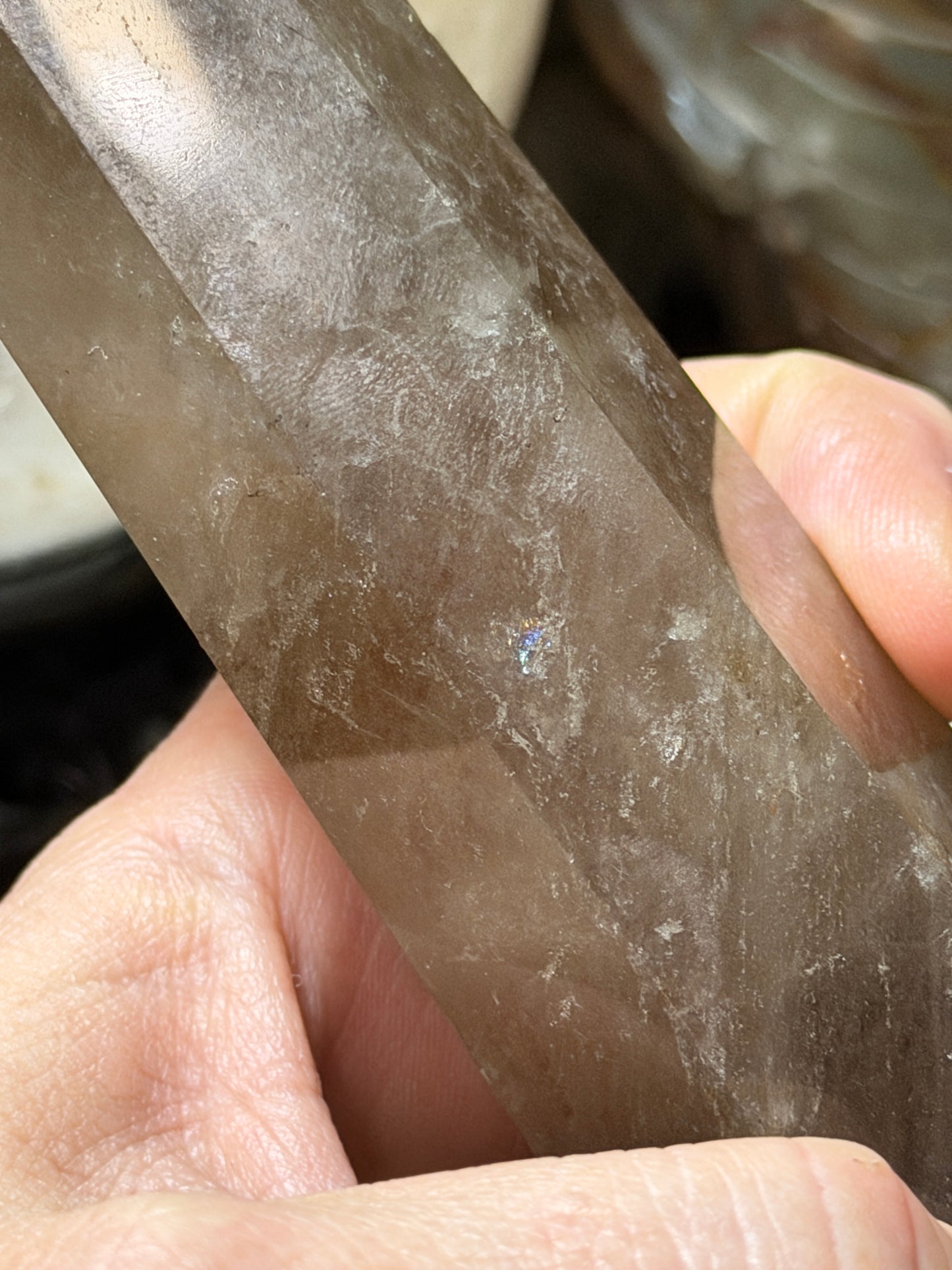 Close-up of polished point on smoky quartz crystal tower